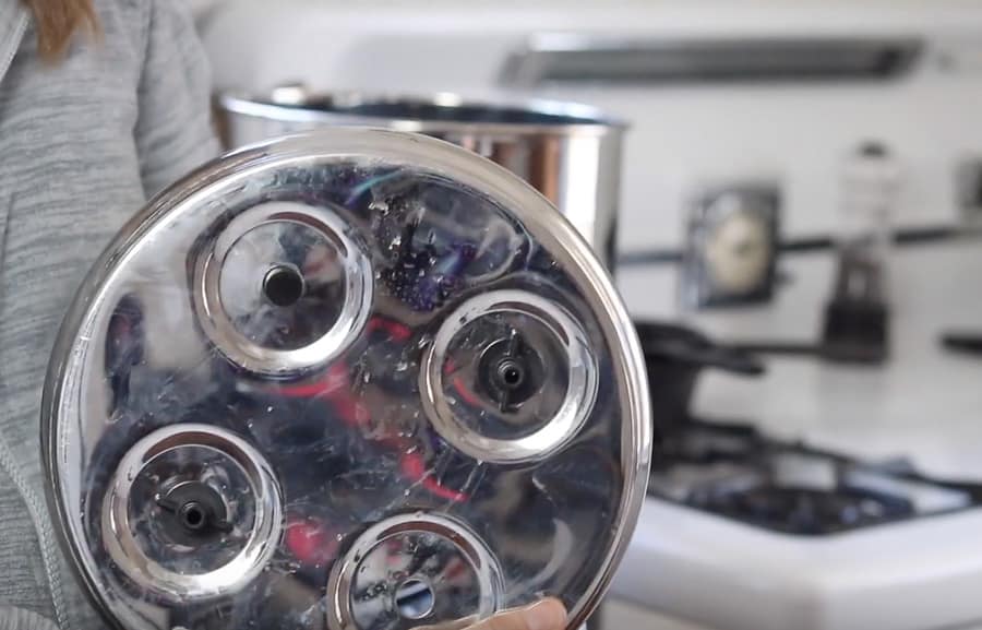 adding stoppers to the open holes of the Berkey water filter