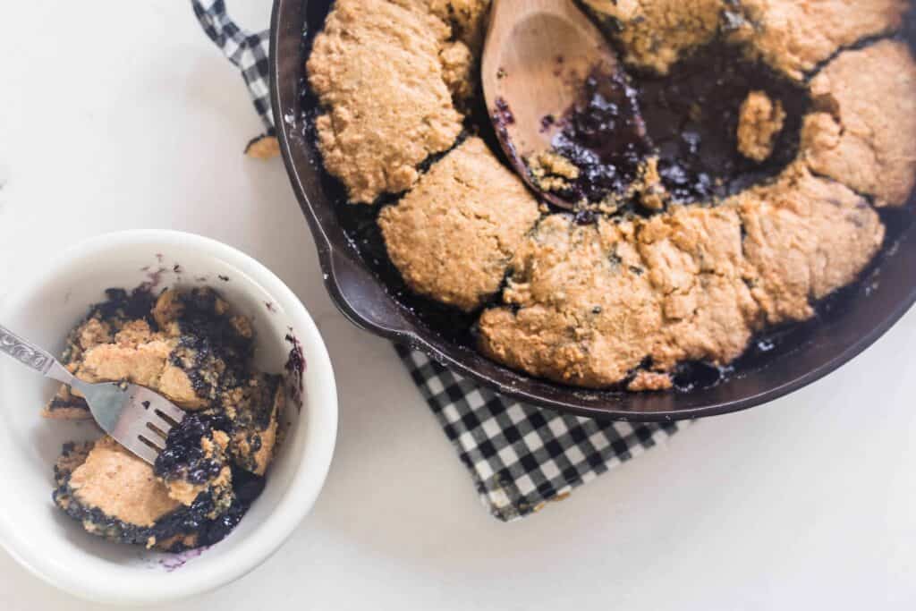 sourdough blueberry cobbler in a cast iron skillet