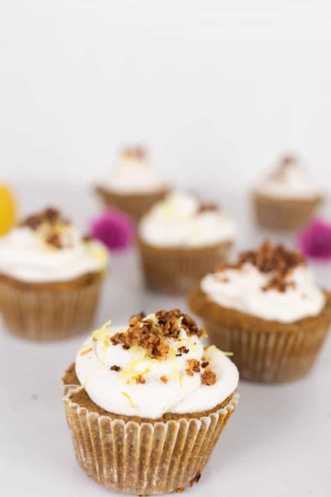 lemon poppy seed muffins with whipped cream, lemon zest and toasted coconut.