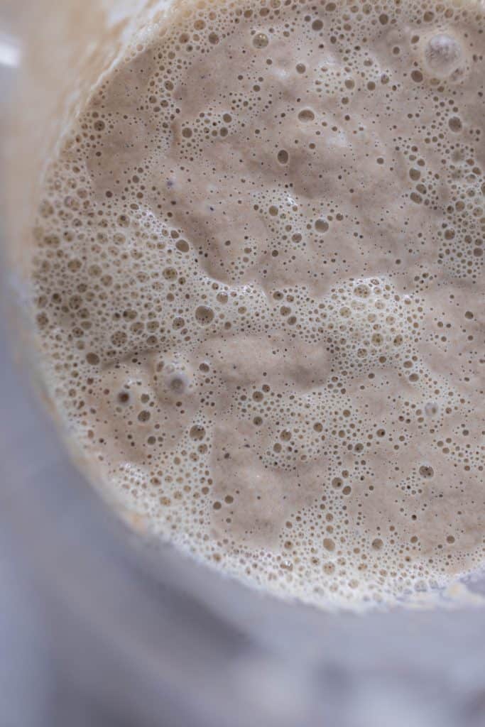 bubbly sourdough starter in a bowl