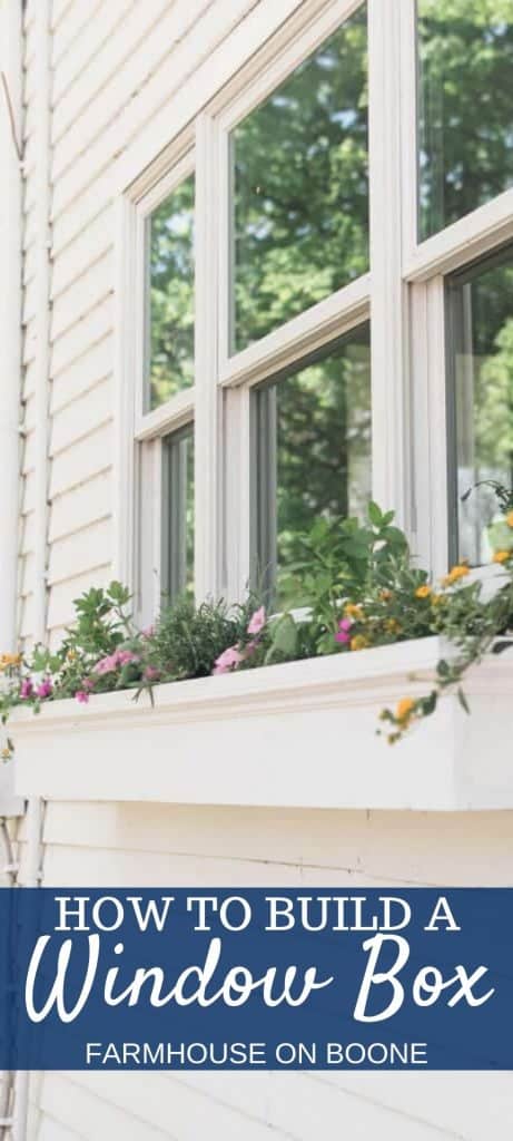 pinterest image of a white diy window box full of flowers