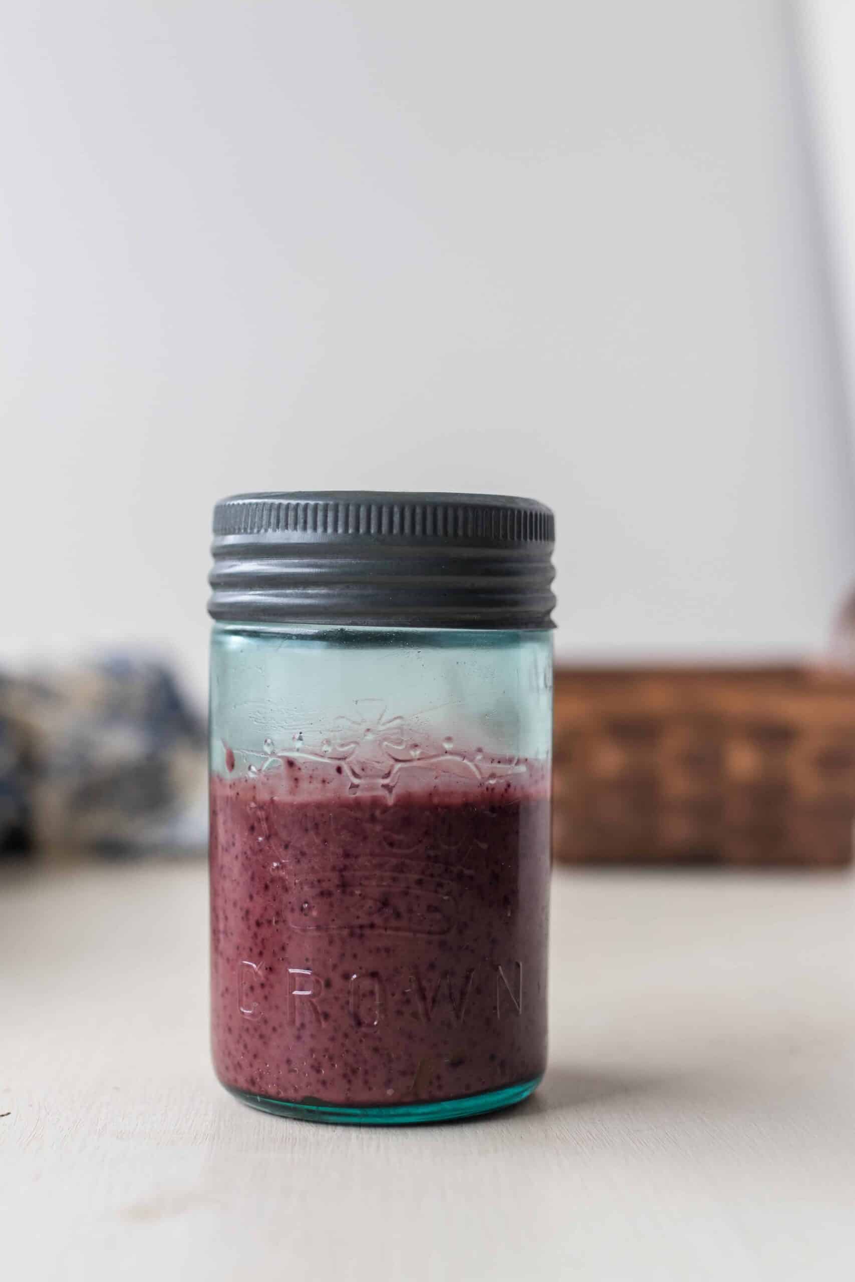 fermented balsamic blueberry vinaigrette in a glass jar with a metal lid