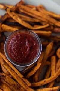 close up overhead photo of fermented ketchup in the middle of sweet potato fries