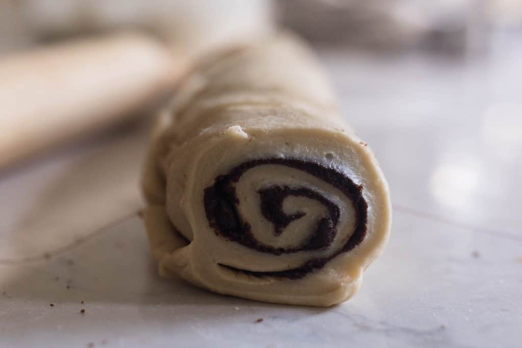 sourdough rolls with chocolate filling rolled up and ready to be sliced
