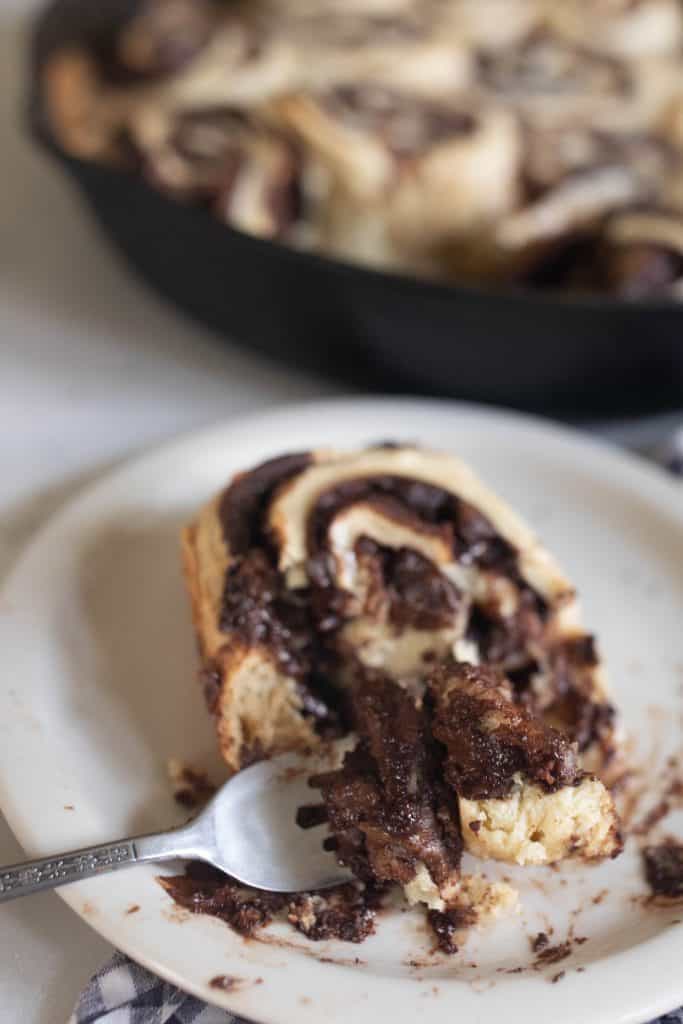 sourdough chocolate rolls on a white plate 