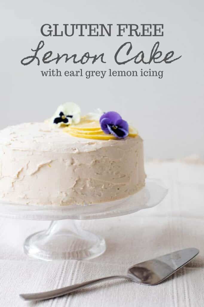 gluten free lemon cake with white lemon and earl grey icing topped with Leons and edible flowers