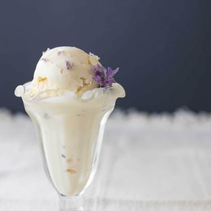 lavender ice cream in a glass Sunday cup with a Lavender flower in the ice cream