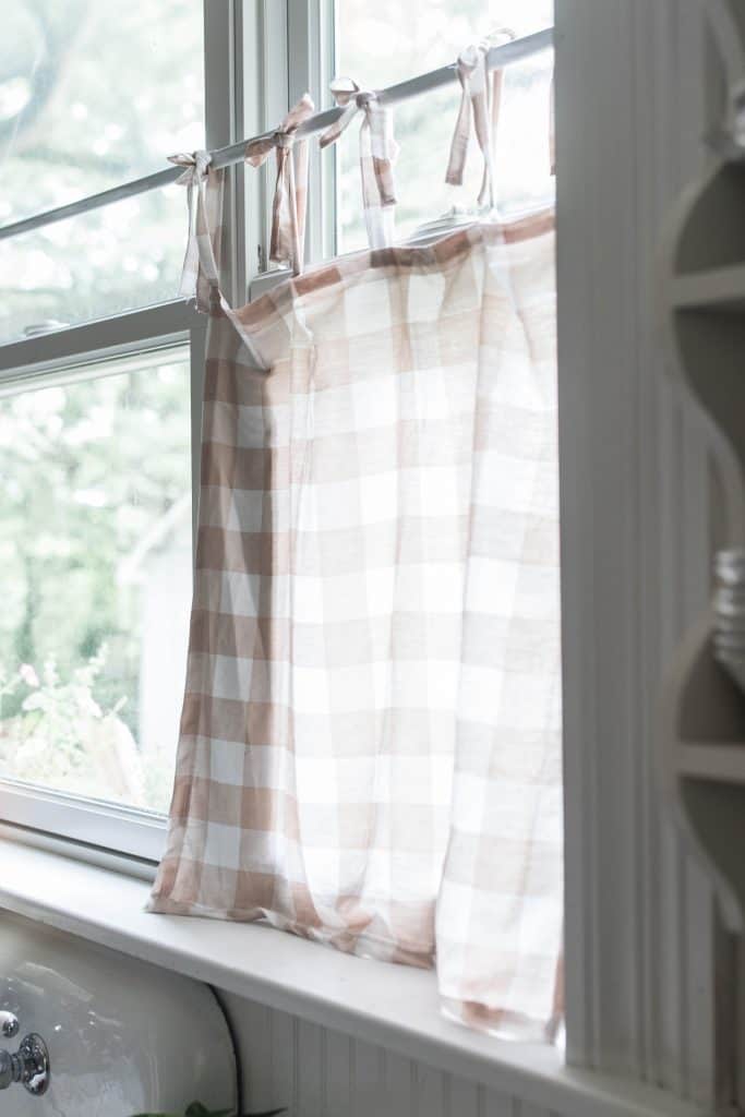 tie top cafe curtains with a peach and cream buffalo check