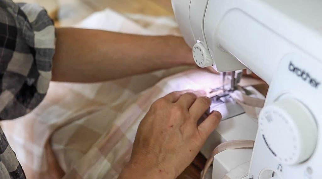 ties being sewn into cafe curtains