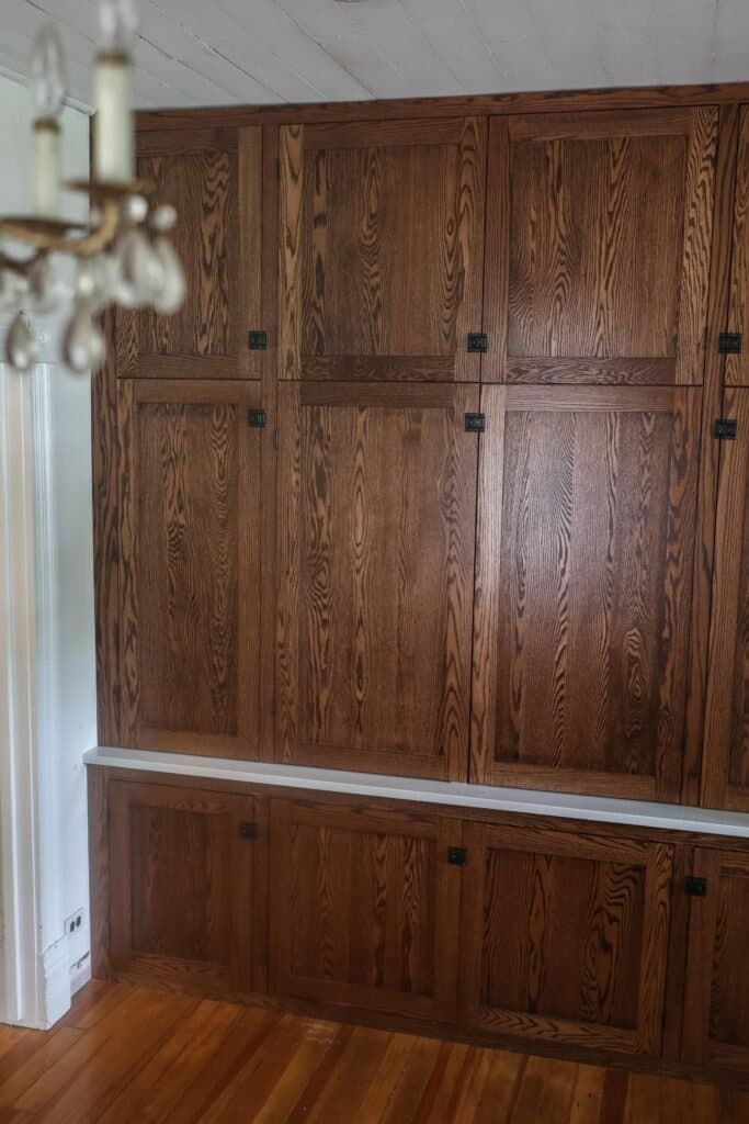 side view of a built in office nook made with antique inspired wood cabinetry and quartz countertops