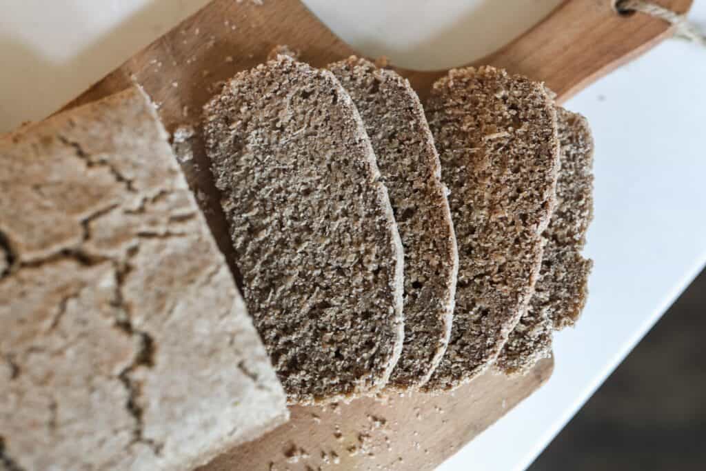 overhead photo of rye bread sliced on a cutting board