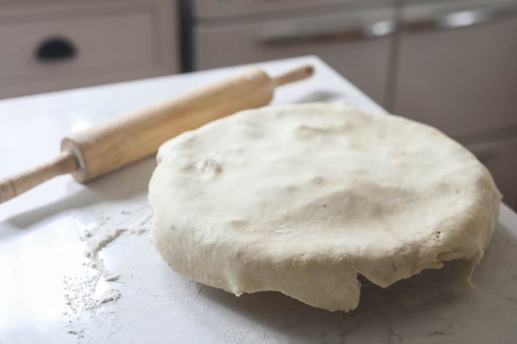 second pie dough layed over the top of a pie