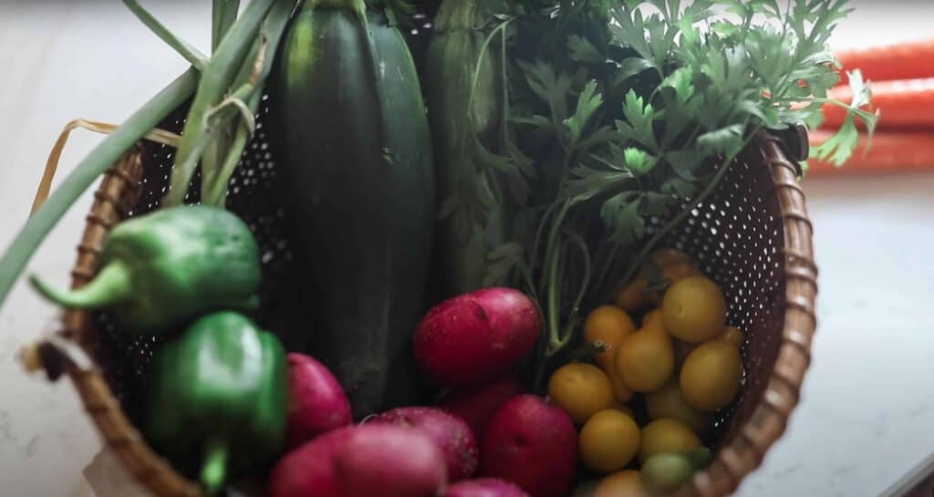 bowl of garden veggies on a white countertop