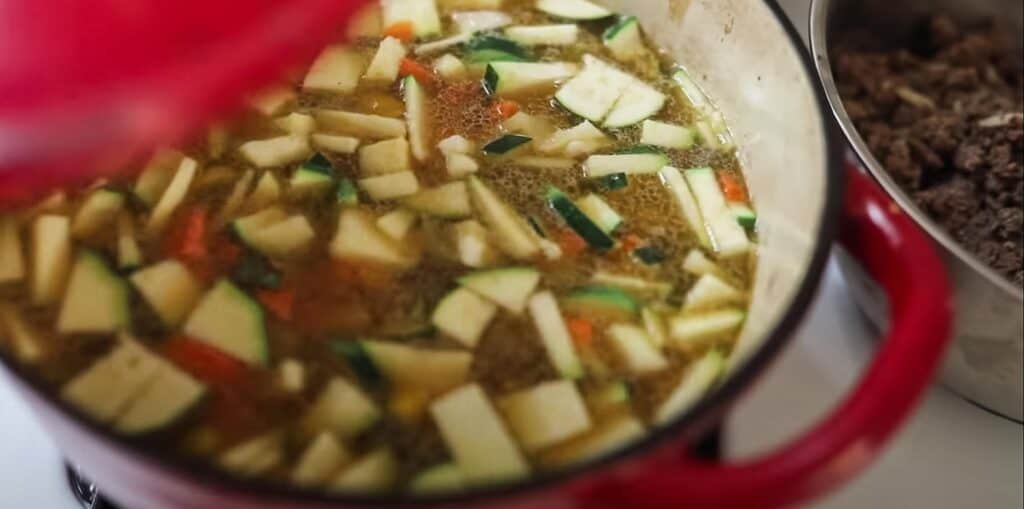 close up of garden soup in a red pot