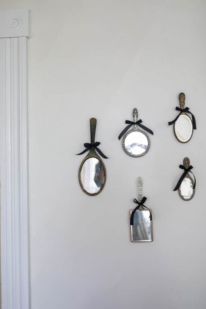 antique mirrors hanging on a wall