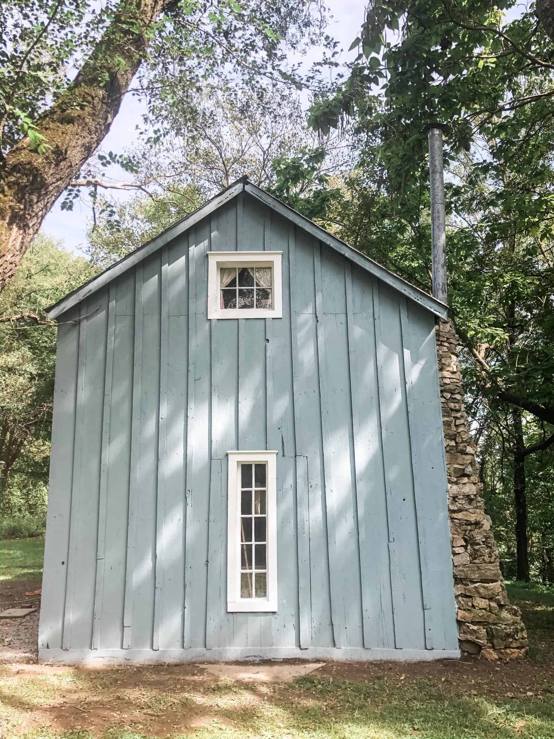 blue cottage with farmhouse window trim