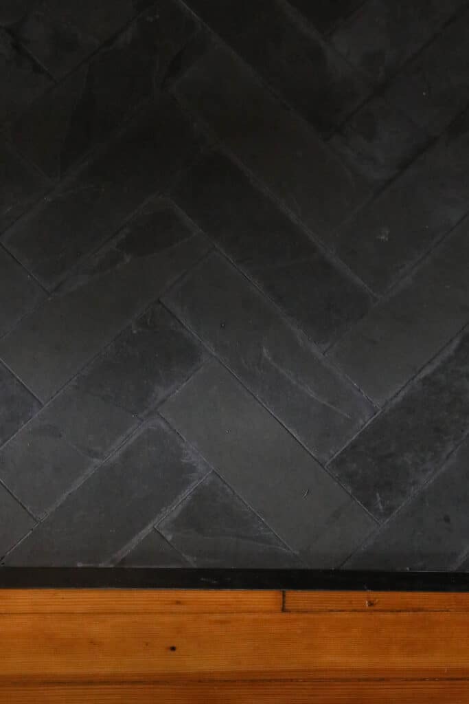 overhead view of slate tile in a herring bone pattern