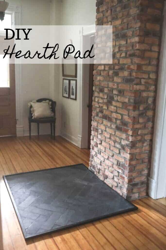 Slate hearth pad for a wood stove with a brick chimney connected.