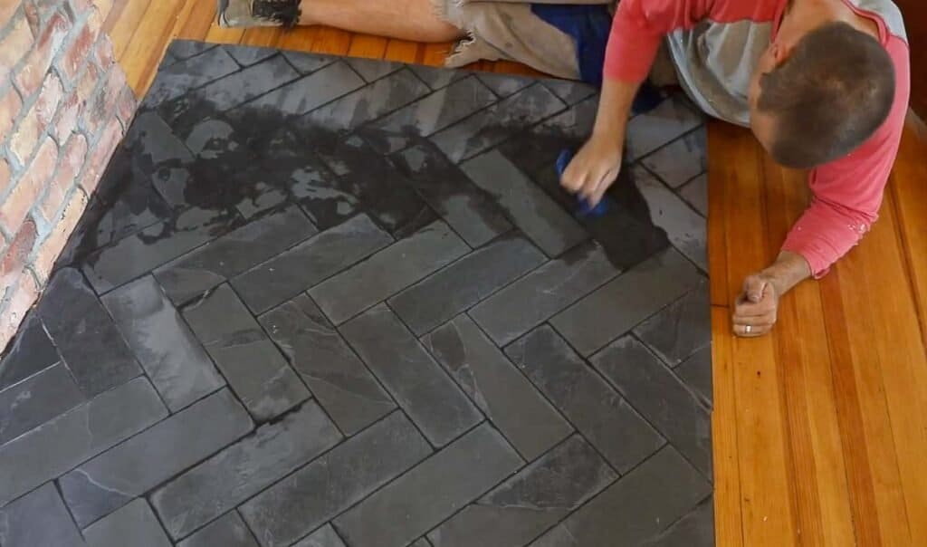 man grouting tile