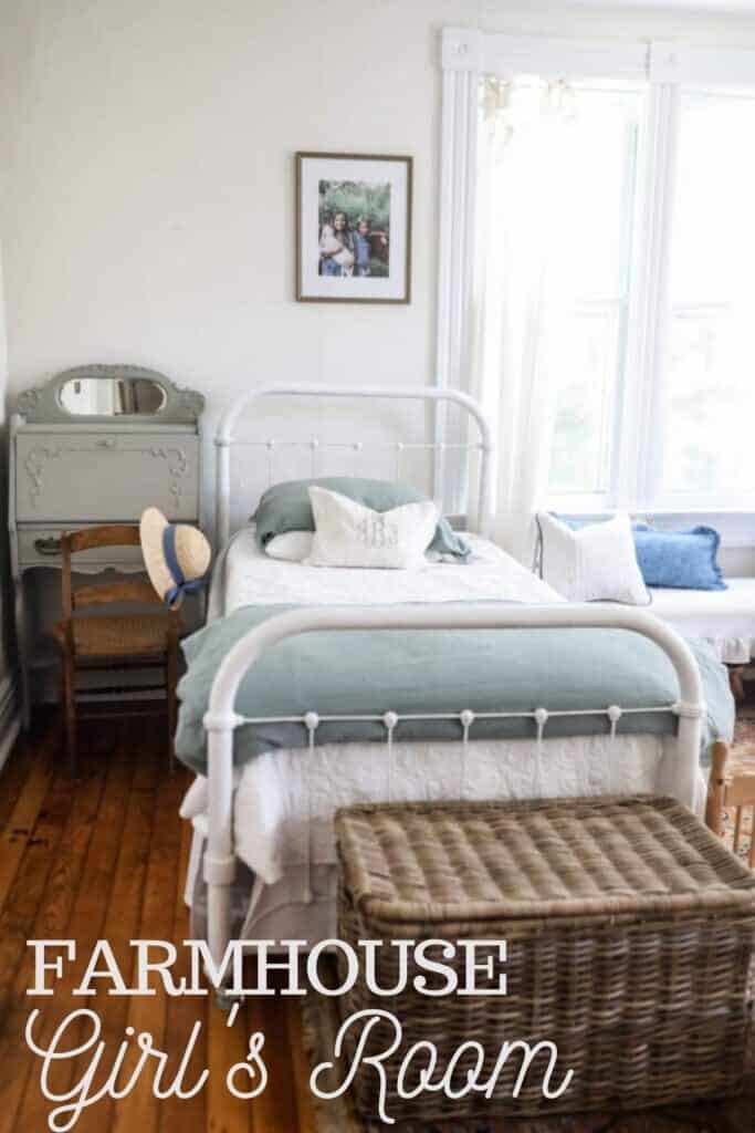 wicker trunks at the foot of white metal beds for storage