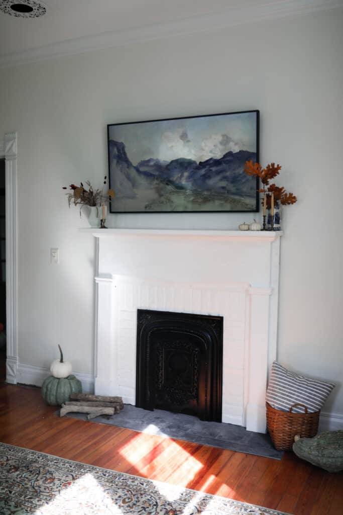 white DIY faux fireplace with white brick and a vintage mantle 