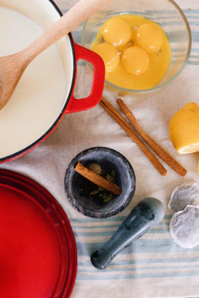 chai ice cream ingredients on a blue and white striped table cloth