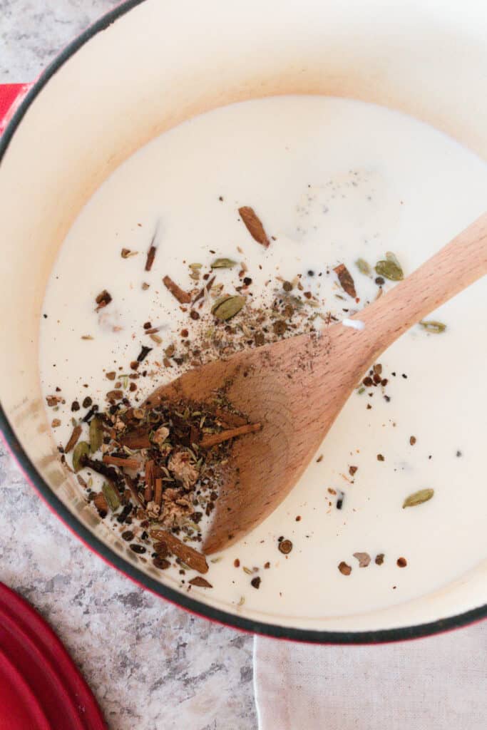 milk steeping with chai spices to make ice cream.
