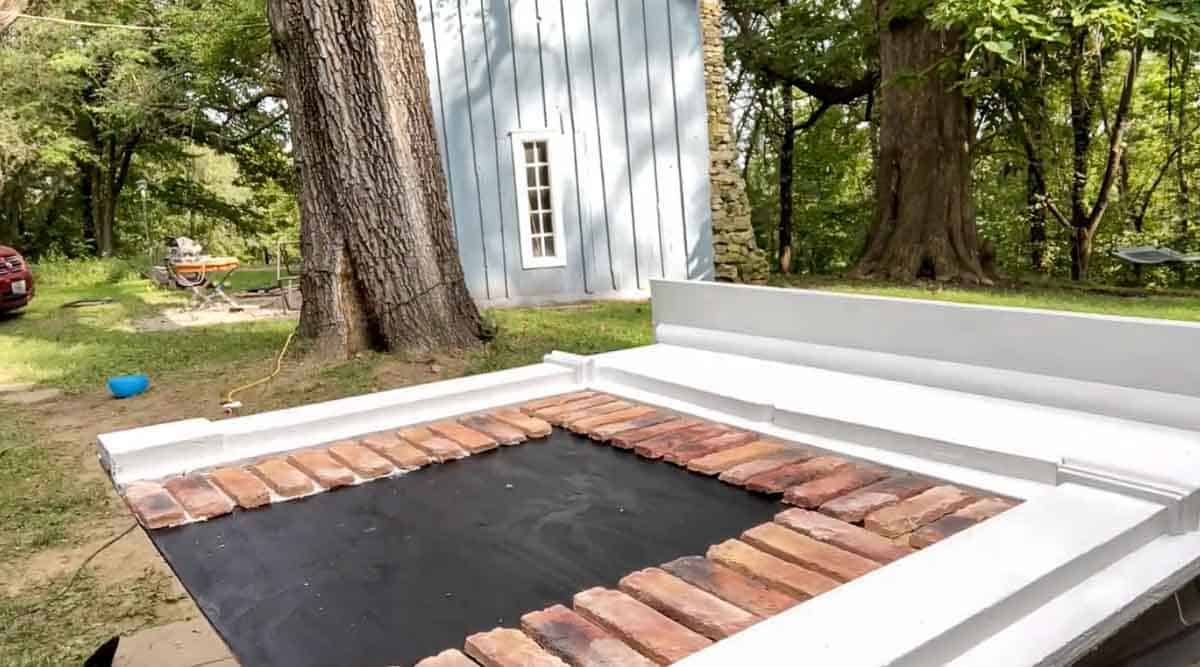 brick layer with thinset on a plywood