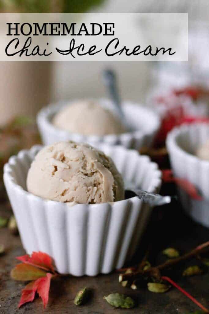chai ice cream in white bowls with spoons. Red fall leaves are set on the table