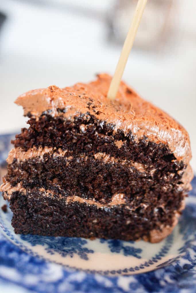 close up picture of a slice of sourdough chocolate cake with chocolate frosting