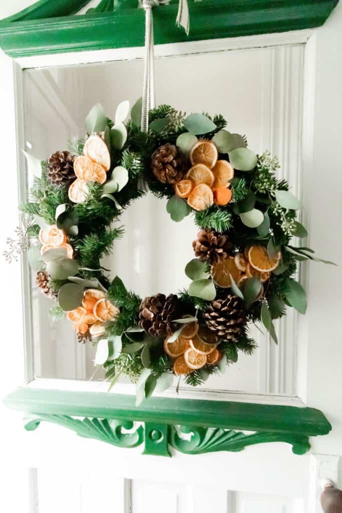 diy Christmas wreath with eucalyptus, oranges, and pine cones