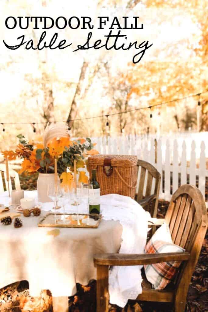 side view of a table with wooden chairs set with a fall tablescape