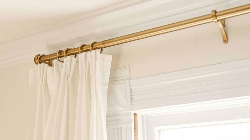 ikea curtain hack using ikea rivta curtains with pleats hung  with brass curtain clips on a brass pole