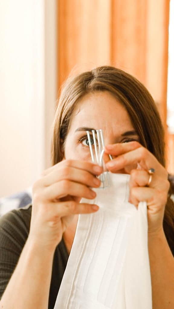 women holding pleater hooks and a ikea Rivta curtain panel