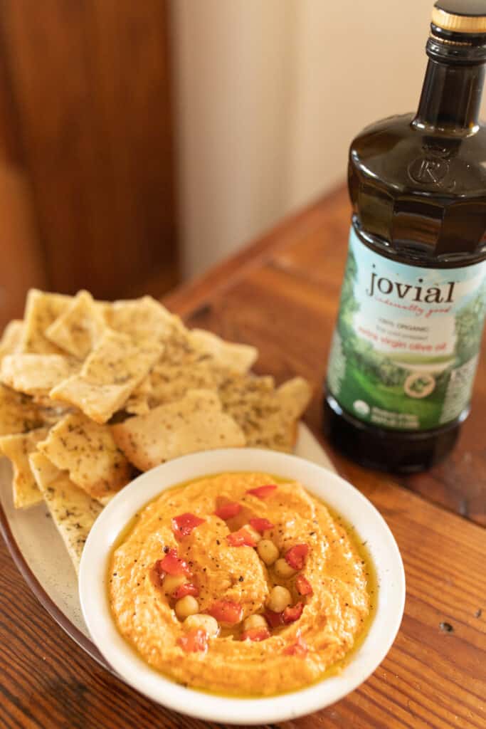 sourdough flat bread with red pepper hummus in a bowl