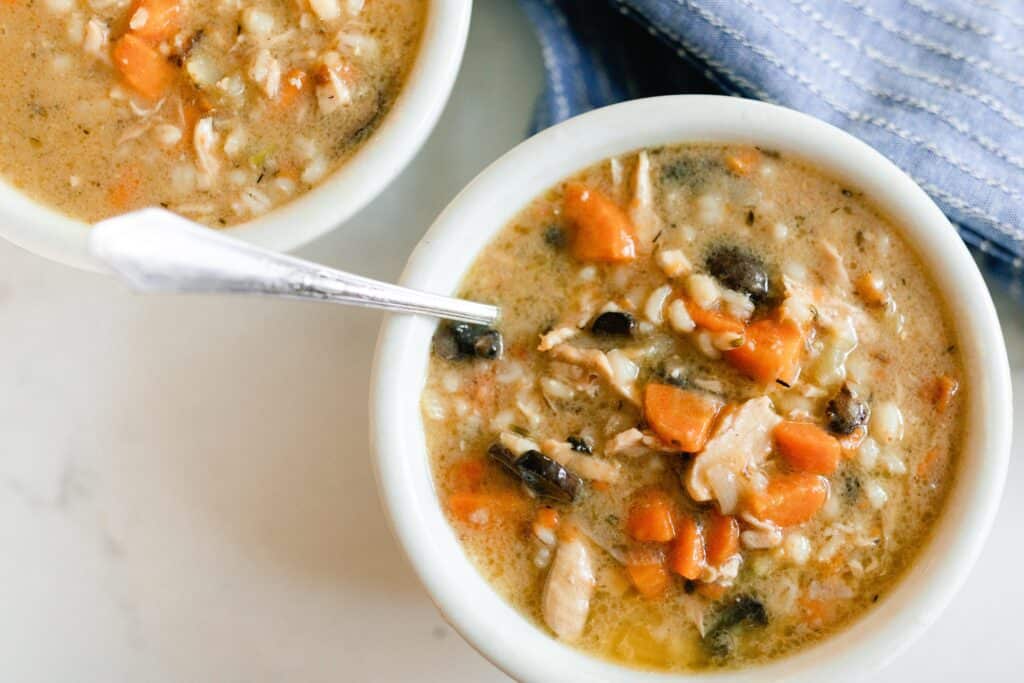 overhead photo of chicken Marsala Soup in a white bowl