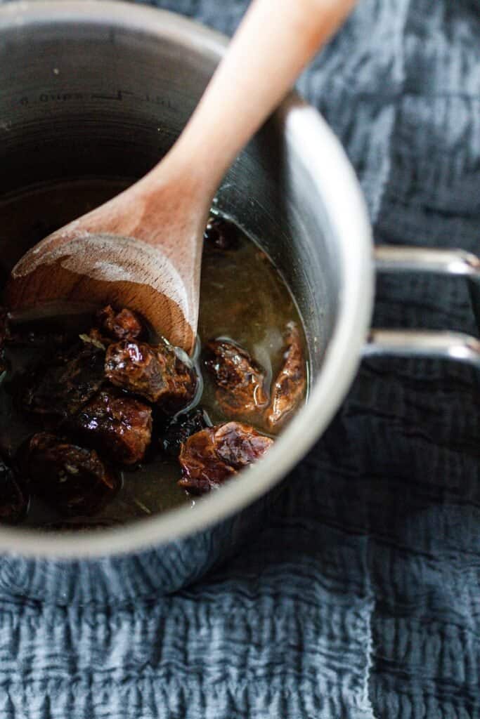 dates in apple cider, orange juice and lemon juice in a saucepan