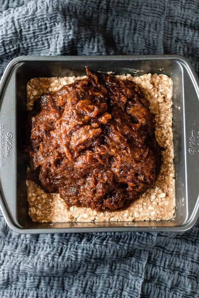 date mixture poured onto oat crumble