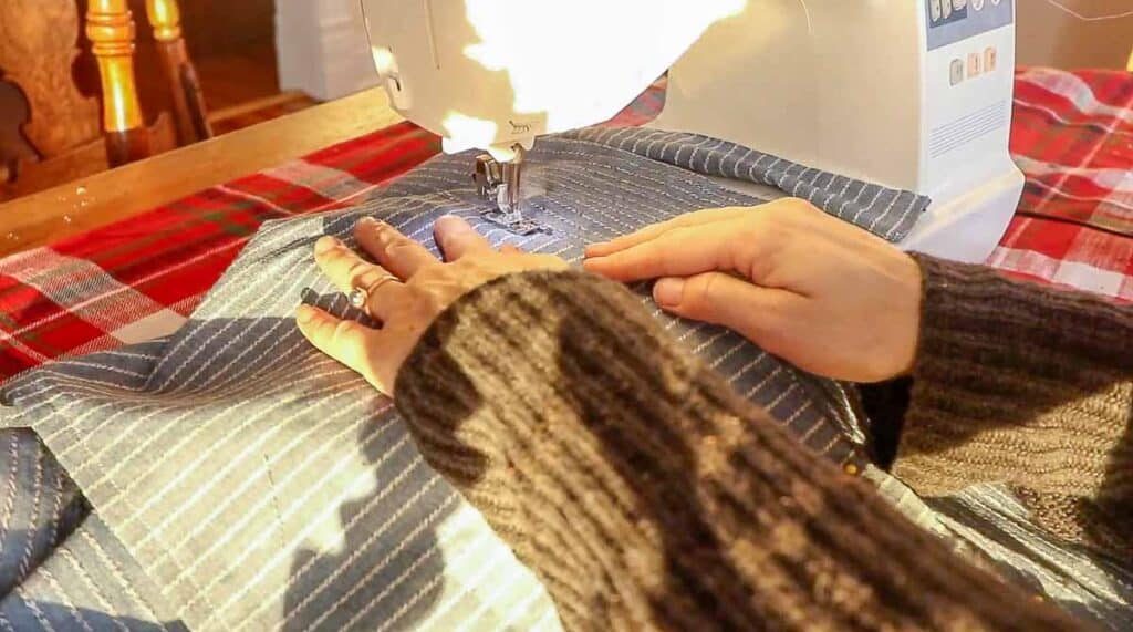 women sewing a pocket onto a half apron with a sewing machine