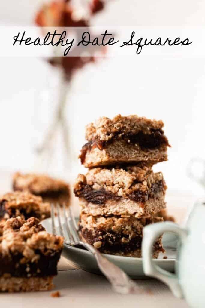 healthy date squares stacked up on a sage plate