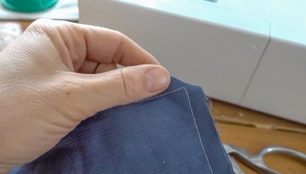 fabric cut from the corner seam to reduce bulk when turning right sides out