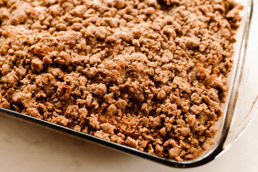 sourdough coffee cake with cinnamon sugar crumble in a glass baking dish