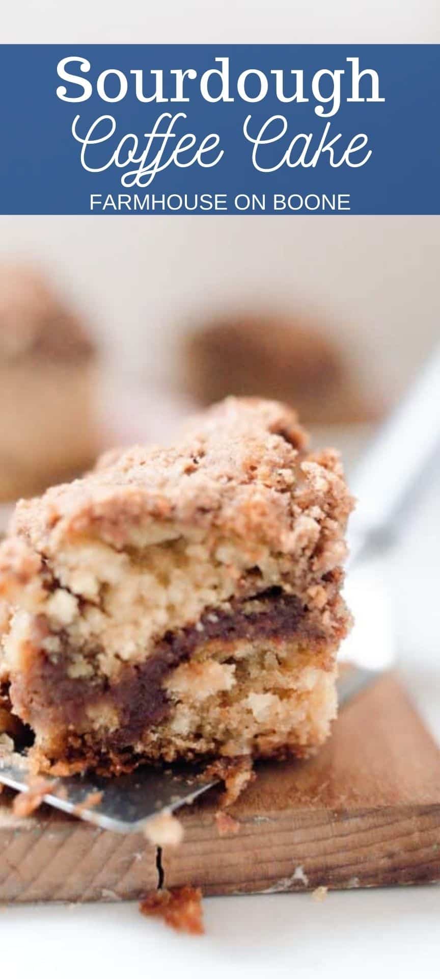 Close up of a large square slice of sourdough coffee cake on a plate with more slices in the background.