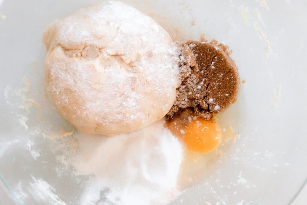 fermented grains with eggs, baking soda, salt and vanilla in a bowl to make cookies