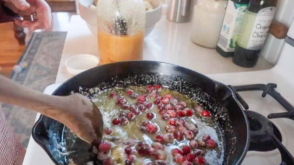 butter, honey, maple syrup, and cranberries in a cast iron skillet.