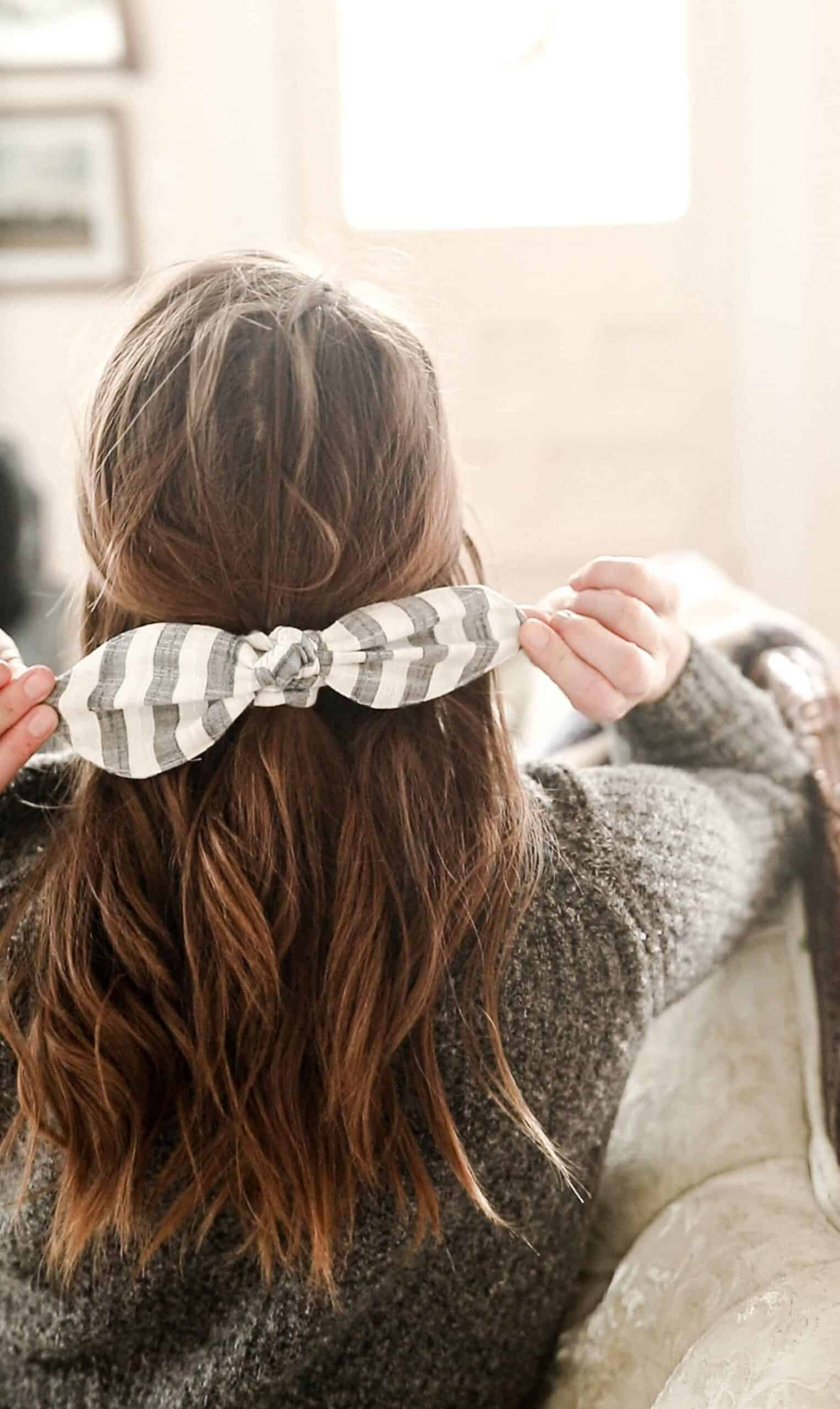 women wearing a stripped DIY scrunch bow