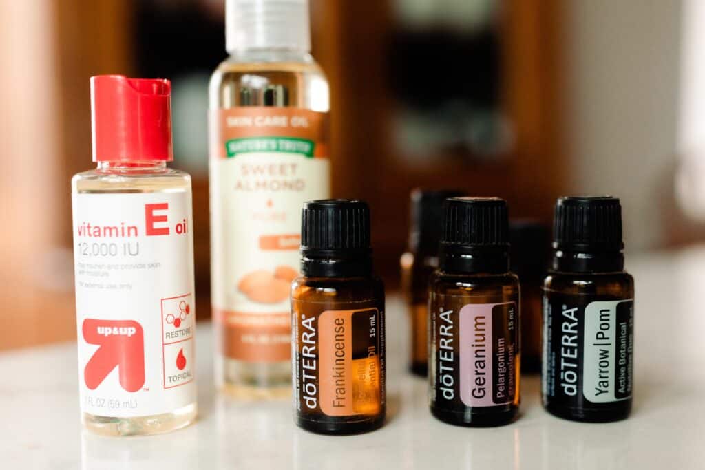 homemade face serum ingredients on a white countertop