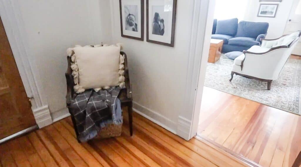 DIY flannel blanket on a antique chair with a pillow in a entryway