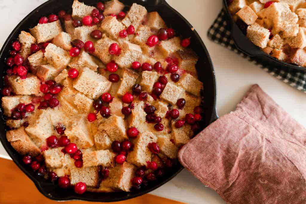cranberry French toast casserole in a cast iron skillet