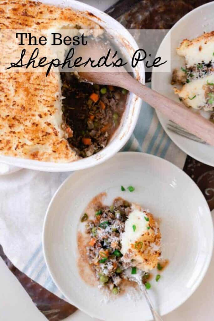 Cottage pie in a baking dish with servings on two white plates